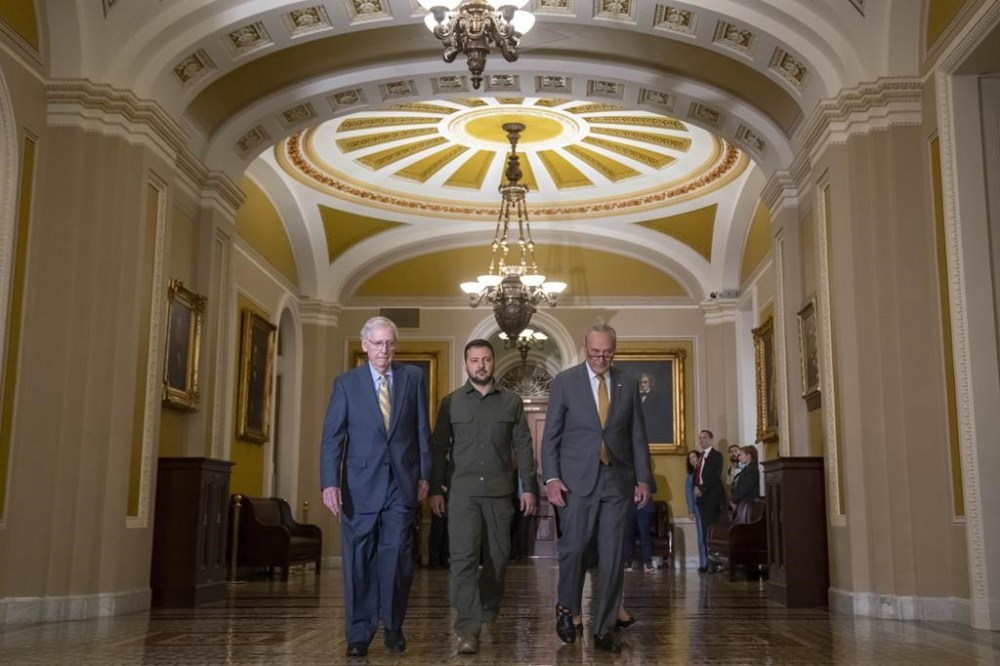 Ukrainian President Volodymyr Zelenskyy, center, walks with Senate Minority Leader Mitch McConnell of Ky., left, and Senate Majority Leader Chuck Schumer of N.Y., right, at Capitol Hill on Thursday, Sept. 21, 2023, in Washington. (AP Photo/Mark Schiefelbein)