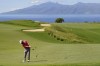 FILE- Jon Rahm, of Spain, hits from the 13th fairway during the final round of the Tournament of Champions golf event, Sunday, Jan. 9, 2022, at Kapalua Plantation Course in Kapalua, Hawaii. The PGA Tour say the tournament will return to Kapalua on Maui five months after the deadly wildfires. (AP Photo/Matt York, File)
