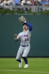 New York Mets left fielder Tim Locastro catches a fly out by Philadelphia Phillies' Bryce Harper during the fifth inning of a baseball game, Thursday, Sept. 21, 2023, in Philadelphia. (AP Photo/Matt Slocum)