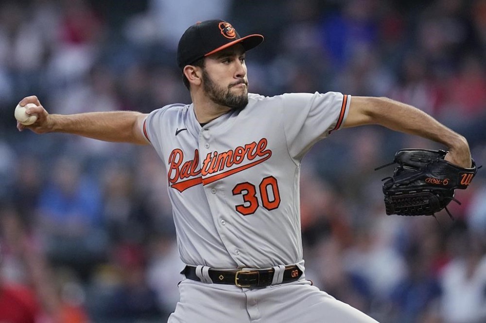 Baltimore Orioles' Grayson Rodriguez pitches to a Cleveland Guardians batter during the first inning of a baseball game Thursday, Sept. 21, 2023, in Cleveland. (AP Photo/Sue Ogrocki)