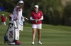 Solheim Cup team US golfer Ally Ewing talks with her caddy during the foursomes play at the Solheim Cup in Finca Cortesin, near Casares, southern Spain, on Friday, Sept. 22, 2023. (AP Photo/Bernat Armangue)