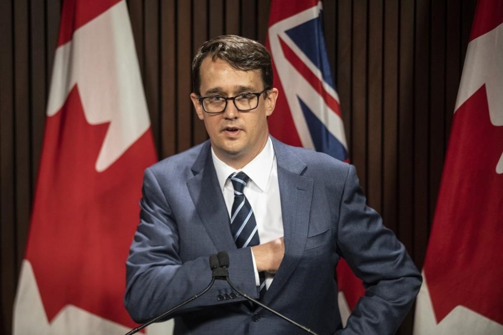 Ontario Labour Minister Monte McNaughton takes to the podium during a news conference in Toronto on Wednesday, April 28, 2021. THE CANADIAN PRESS/Chris Young
