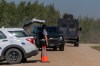 A tactical armoured RCMP vehicle drives past a police roadblock set up at James Smith Cree Nation, Sask., on Tuesday, Sept. 6, 2022. Parole Board of Canada employees were fearful of threats after it was revealed a mass killer in Saskatchewan was on statutory release at the time of last year's rampage, newly released internal emails show. THE CANADIAN PRESS/Heywood Yu