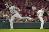 Minnesota Twins third baseman Royce Lewis (23) attempts to throw out Cincinnati Reds' Nick Senzel (not shown) at first base in the seventh inning of a baseball game in Cincinnati, Monday, Sept. 18, 2023. Senzel was safe on the play. (AP Photo/Jeff Dean)