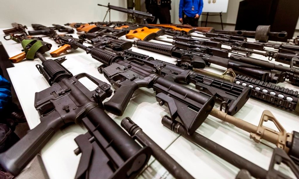 FILE - A variety of military-style semi-automatic rifles obtained during a buy back program are displayed at Los Angeles police headquarters on Dec. 27, 2012, in Los Angeles. A federal judge on Friday, Sept. 22, 2023, struck down a California law banning high-capacity magazines. (AP Photo/Damian Dovarganes, File)