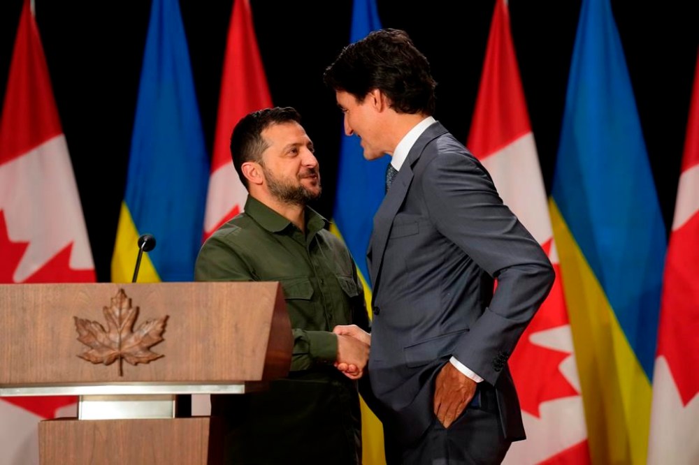 Ukrainian President Volodymyr Zelenskyy, left, and Prime Minister Justin Trudeau shake hands at a joint press conference on Parliament Hill in Ottawa on Friday, Sept. 22, 2023. THE CANADIAN PRESS/Adrian Wyld