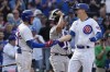 Chicago Cubs' Jared Young, right, celebrates with Miles Mastrobuoni after hitting a two-run home run during the sixth inning of a baseball game against the Colorado Rockies in Chicago, Friday, Sept. 22, 2023. (AP Photo/Nam Y. Huh)