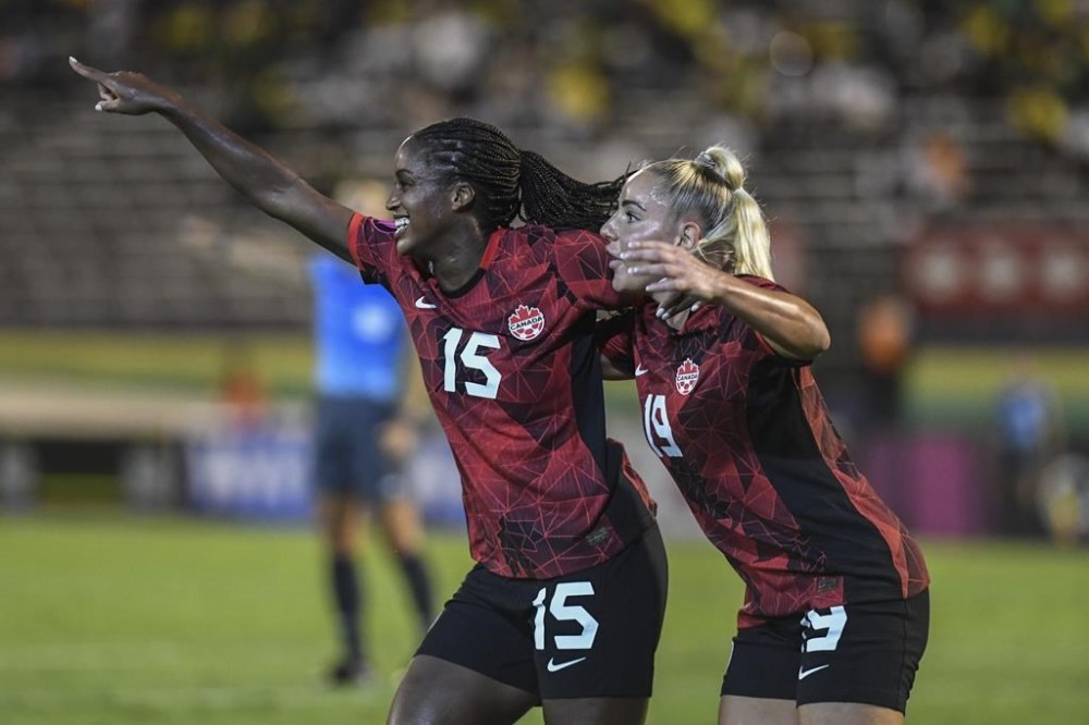Canada's Nichelle Prince, left, celebrates her goal against Jamaica with her teammate Adriana Leon, during a CONCACAF women's championship soccer series match in Kingston, Jamaica, Friday, Sept. 22, 2023. (AP Photo/Collin Reid)