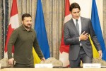 Prime Minister Justin Trudeau and Ukrainian President Volodymyr Zelenskyy take their seats ahead of a meeting with business leaders in Toronto, on Friday, Sept. 22, 2023. THE CANADIAN PRESS/Spencer Colby