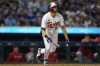 Minnesota Twins' Alex Kirilloff watches his solo home run during the sixth inning of a baseball game against the Los Angeles Angels, Friday, Sept. 22, 2023, in Minneapolis. (AP Photo/Abbie Parr)