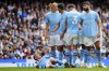 Manchester City's Phil Foden, left, takes his position on the wall before a free kick during the English Premier League soccer match between Manchester City and Nottingham Forest at Etihad stadium in Manchester, England, Saturday, Sept. 23, 2023. (AP Photo/Jon Super)