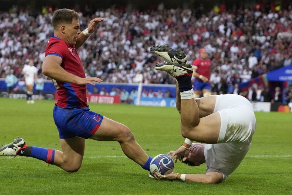 England's Henry Arundell scores a try during the Rugby World Cup Pool D match between England and Chile at the Stade Pierre Mauroy in Villeneuve-d'Ascq, outside Lille, Saturday, Sept. 23, 2023. (AP Photo/Themba Hadebe)