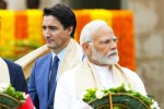 Canada's Prime Minister Justin Trudeau, left, walks past Indian Prime Minister Narendra Modi as they take part in a wreath-laying ceremony at Raj Ghat, Mahatma Gandhi's cremation site, during the G20 Summit in New Delhi, Sunday, Sept. 10, 2023. THE CANADIAN PRESS/Sean Kilpatrick