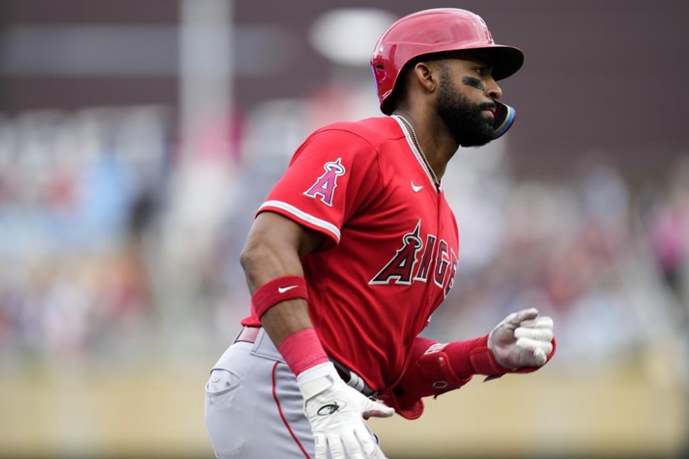 Los Angeles Angels' Jo Adell runs the bases after hitting a solo home run during the fourth inning of a baseball game against the Minnesota Twins, Saturday, Sept. 23, 2023, in Minneapolis. (AP Photo/Abbie Parr)
