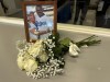 A framed photo of Margarita and Manny Mota along with a bouquet of white roses sits in the Dodger Stadium press box on Saturday, Sept. 23, 2023, in Los Angeles. Margarita Mota, the wife of retired Los Angeles Dodgers outfielder Manny Mota and matriarch of a baseball family, died Saturday, according to her son José Mota. (AP Photo/Beth Harris)
