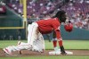 Cincinnati Reds' Elly De La Cruz loses his helmet after stealing third base during the second inning of the team's baseball game against the Pittsburgh Pirates, Saturday, Sept. 23, 2023, in Cincinnati. (AP Photo/Joshua A. Bickel)