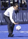 Inter coach Simone Inzaghi reaches out for the ball during the Italian Serie A soccer match between Empoli and Inter Milan at the Castellani Stadium in Empoli, Italy, Sunday, Sept. 24, 2023. (Marco Bucco/LaPresse via AP)
