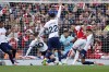 Tottenham's Cristian Romero, right, tries to block a shot from Arsenal's Ben White during the English Premier League soccer match between Arsenal and Tottenham Hotspur at Emirates stadium in London, England, Sunday, Sept. 24, 2023. A penalty was awarded to Arsenal for a handball by Romero.(AP Photo/David Cliff)