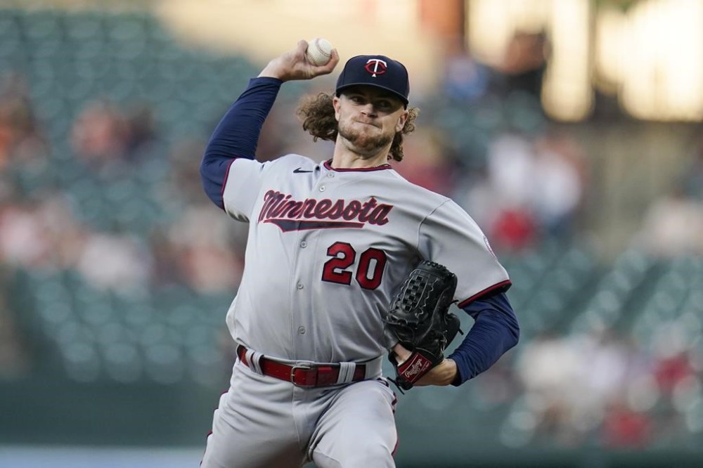 FILE - Minnesota Twins starting pitcher Chris Paddack throws a pitch to the against the Baltimore Orioles during the first inning of a baseball game, May 2, 2022, in Baltimore. Paddack was activated by the Twins on Sunday, Sept. 24, 2023, 16 months after he had Tommy John surgery for the second time. (AP Photo/Julio Cortez, File)