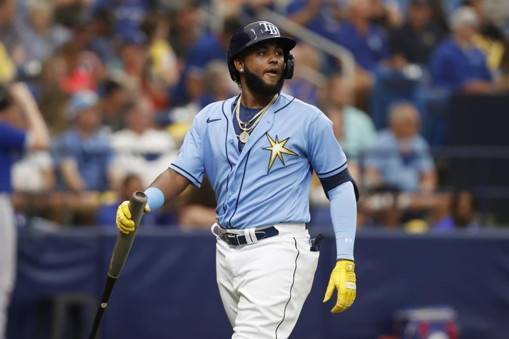 Tampa Bay Rays' Junior Caminero walks to the dugout after striking out against the Toronto Blue Jays during the fifth inning of a baseball game Sunday, Sept. 24, 2023, in St. Petersburg, Fla. (AP Photo/Scott Audette)