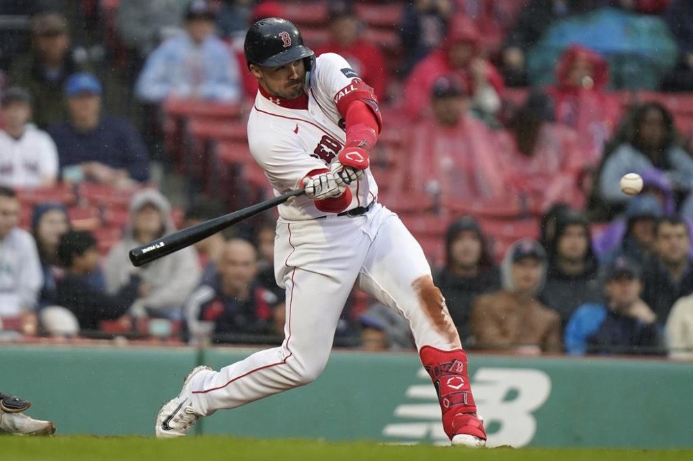 Boston Red Sox's Adam Duvall hits a home run in the sixth inning of a baseball game against the Chicago White Sox, Sunday, Sept. 24, 2023, in Boston. (AP Photo/Steven Senne)