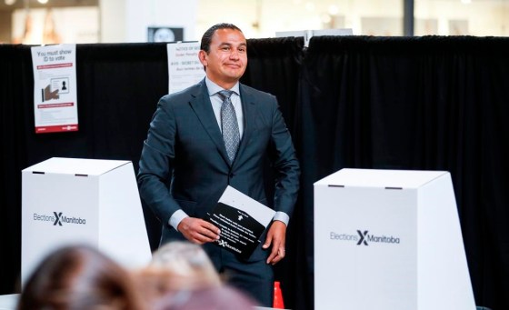 NDP leader Wab Kinew votes in an early poll on Saturday, (John Woods / The Canadian Press files)