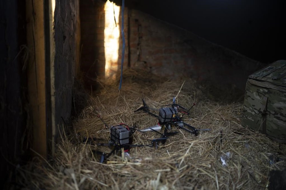 Exploding drones loaded with shells lay inside a hay barn on the front line in the outskirts of Kremmina, Ukraine, Sunday, Aug. 20, 2023. The drone unit's task is to destroy Russia's heavy machinery, armored vehicles and infantry. (AP Photo/Bram Janssen)
