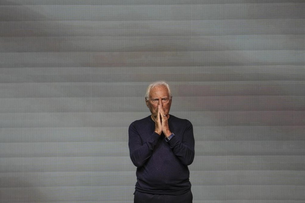 Designer Giorgio Armani accepts applause after the conclusion of his women's Spring Summer 2024 collection presented in Milan, Italy, Sunday, Sept. 24, 2023. (AP Photo/Luca Bruno)