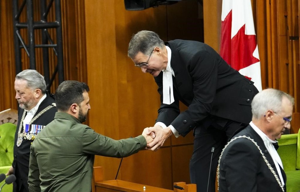 The Speaker of the House of Commons Anthony Rota shakes hands with Ukrainian President Volodymyr Zelenskyy in the House of Commons on Parliament Hill in Ottawa on Friday, Sept. 22, 2023. During Zelenskyy's visit to Ottawa, MPs in the House of Commons honoured 98-year-old Yaroslav Hunka, who fought for the First Ukrainian Division. Hunka was invited by Rota, who introduced him. THE CANADIAN PRESS/Sean Kilpatrick