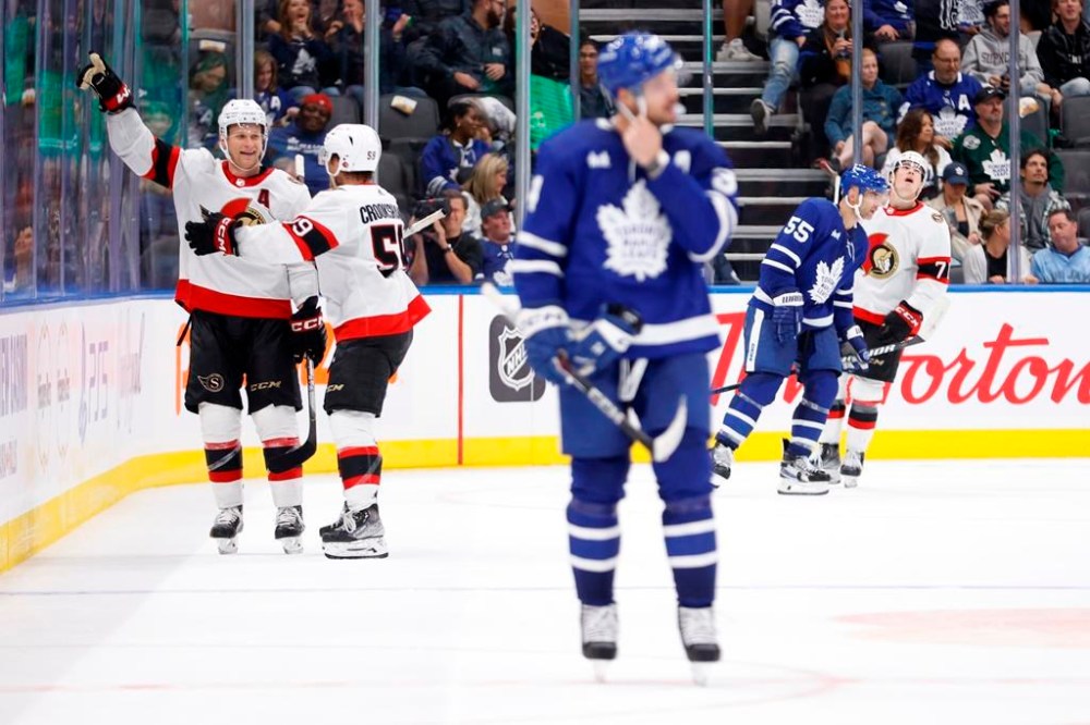 Ottawa Senators defenceman Jakob Chychrun (6) celebrates his game winning goal alongside left wing Angus Crookshank (59) during overtime in preseason NHL hockey against the Toronto Maple Leafs in Toronto on Monday, September 25, 2023. THE CANADIAN PRESS/Cole Burston