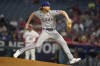 Texas Rangers starting pitcher Jon Gray throws to the mound during the first inning of a baseball game against the Los Angeles Angels, Monday, Sept. 25, 2023, in Anaheim, Calif. (AP Photo/Ryan S. Sun)