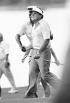 FILE - U.S. golfer Calvin Peete congratulates Lanny Wadkins after his shot into the 18th hole to halve his match against Spanish golfer Jose Maria Canizares at the PGA National golf course, which won the Ryder Cup for the U.S. team in Palm Beach Gardens, Fla., on Oct. 16, 1983. Wadkins is regarded as the last American known most for his Ryder Cup play. (AP Photo/Kathy Willens, File)