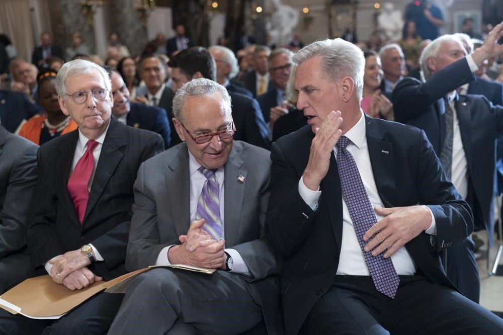 FILE—From left, Senate Minority Leader Mitch McConnell, R-Ky., Senate Majority Leader Chuck Schumer, D-N.Y., and Speaker of the House Kevin McCarthy, R-Calif., take time out from their struggle over the debt limit negotiations to attend a ceremony at the Capitol in Washington, May 17, 2023. With days to go before a government shutdown, Congress returns to work in crisis mode this week as McCarthy faces an insurgency from hard-right Republicans eager to slash spending even if it means closing federal offices to millions of Americans. (AP Photo/J. Scott Applewhite, File)