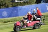 United States' Team Captain Zach Johnson drive a buggy with United States' Jordan Spieth on the back round the course during a practice round ahead of the Ryder Cup at the Marco Simone Golf Club in Guidonia Montecelio, Italy, Tuesday, Sept. 26, 2023. The Ryder Cup starts Sept. 29, at the Marco Simone Golf Club. (AP Photo/Alessandra Tarantino)