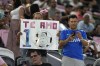 A fan holds up a sign for Inter Miami forward Lionel Messi in spanish that reads 
