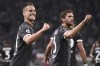 Torino's Arkadiusz Milik, left, celebrates after scoring the opening goal during the Serie A soccer match between Juventus FC and Lecce in Torino, Italy, Tuesday, Sept. 26, 2023. (Fabio Ferrari/LaPresse via AP)