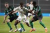 Bayern's Kingsley Coman, center, and Muenster's Daniel Kamkam Kyerewaa, right, challenge for the ball during the German Soccer Cup first round match between Preussen Muenster and Bayern Munich in Muenster, Germany, Tuesday, Sept. 26, 2023. (AP Photo/Martin Meissner)