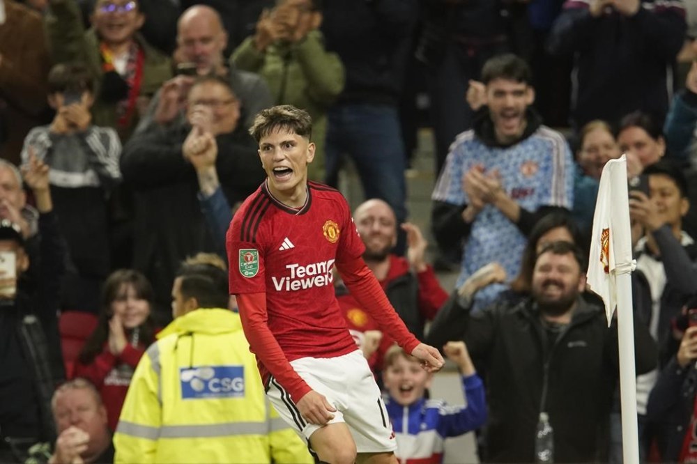 Manchester United's Alejandro Garnacho celebrates after scoring his side's opening goal during the English League Cup third round soccer match between Manchester United and Crystal Palace at Old Trafford stadium in Manchester, England, Tuesday, Sept. 26, 2023. (AP Photo/Dave Thompson)