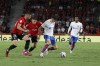 Barcelona's Robert Lewandowski, right, challenges for the ball with Mallorca's Martin Valjent, left, and Mallorca's Giovanni Gonzalez during a Spanish La Liga soccer match between Mallorca and Barcelona at the Son Moix stadium in Palma de Mallorca, Spain, Tuesday, Sept. 26, 2023. (AP Photo/Francisco Ubilla)