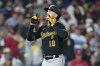 Pittsburgh Pirates' Bryan Reynolds reacts after hitting a home run against Philadelphia Phillies pitcher Aaron Nola during the seventh inning of a baseball game, Tuesday, Sept. 26, 2023, in Philadelphia. (AP Photo/Matt Slocum)