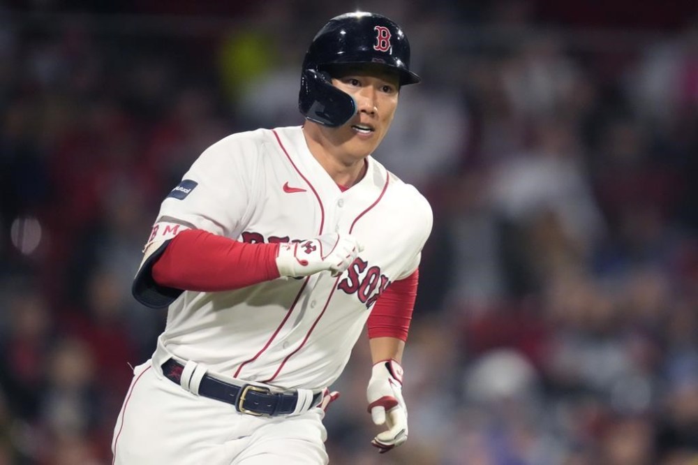 Boston Red Sox's Masataka Yoshida dashes down the first base line on a double during the sixth inning of the team's baseball game against the Tampa Bay Rays at Fenway Park, Tuesday, Sept. 26, 2023, in Boston. (AP Photo/Charles Krupa)