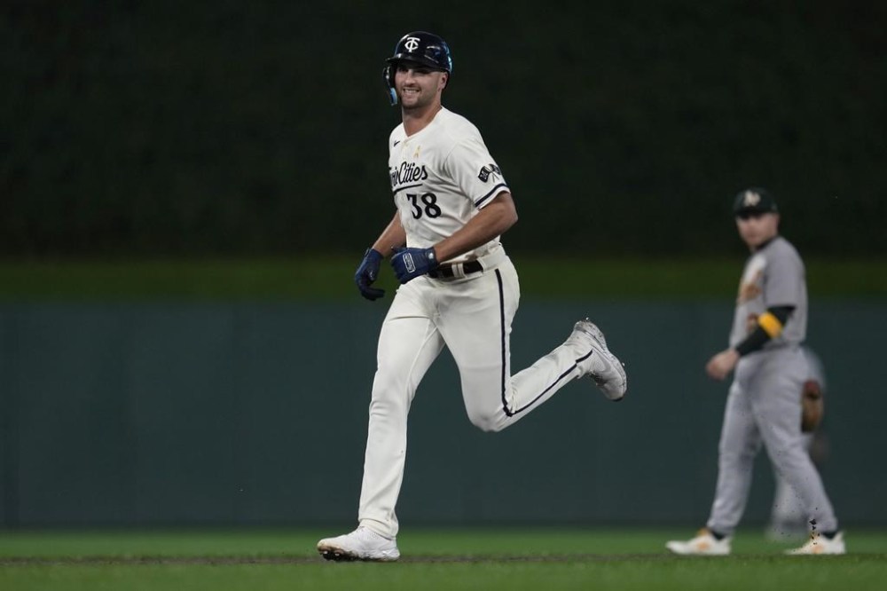 Minnesota Twins' Matt Wallner runs the bases after hitting a grand slam against the Oakland Athletics during the first inning of a baseball game Tuesday, Sept. 26, 2023, in Minneapolis. (AP Photo/Abbie Parr)