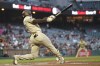 San Diego Padres' Juan Soto hits a home run during the first inning of a baseball game against the San Francisco Giants in San Francisco, Tuesday, Sept. 26, 2023. (AP Photo/Jeff Chiu)