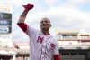 Cincinnati Reds' Joey Votto acknowledges the crowd after being taken out of the game during the eighth inning of a baseball game against the Pittsburgh Pirates in Cincinnati, Sunday, Sept. 24, 2023. (AP Photo/Aaron Doster)