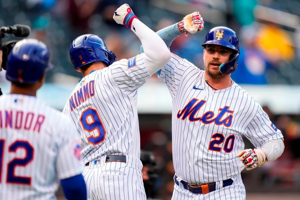 New York Mets' Pete Alonso (20) celebrates with teammatesm Brandon Nimmo (9) and Francisco Lindor (12) after hitting a two-run home run during the first inning in the first baseball game of a doubleheader against the Miami Marlins, Wednesday, Sept. 27, 2023, in New York. (AP Photo/Frank Franklin II)