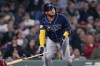 Tampa Bay Rays' Harold Ramirez watches the flight of his sacrifice fly, which scored Randy Arozarena, during the fourth inning of a baseball game against the Boston Red Sox at Fenway Park, Wednesday, Sept. 27, 2023, in Boston. (AP Photo/Charles Krupa)