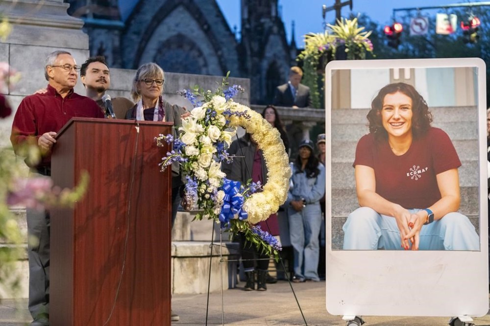 Frank LaPere, Nico LaPere and Caroline Frank, the family of Pava LaPere, founder of tech startup EcoMap Technologies, speak during a vigil on Wednesday, Sept. 27, 2023, in Baltimore. Loved ones are remembering the slain Baltimore tech entrepreneur for her compassion and dedication to helping others. Baltimore police found 26-year-old Pava LaPere dead from blunt force trauma in her apartment complex after she was reported missing late Monday morning. (AP Photo/Stephanie Scarbrough)