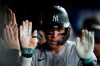 New York Yankees right fielder Aaron Judge (99) celebrates with teammates in the dugout after hitting a second two-run home run against the Toronto Blue Jays, during the seventh inning MLB baseball action in Toronto, Wednesday, Sept. 27, 2023. THE CANADIAN PRESS/Frank Gunn