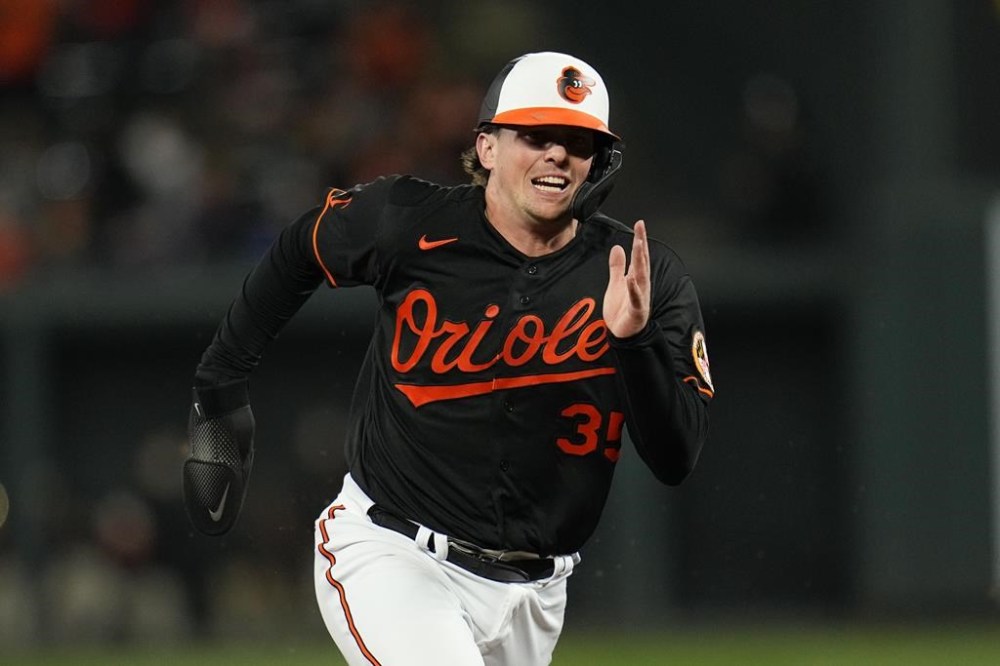 Baltimore Orioles designated hitter Adley Rutschman runs the bases on a hit by Anthony Santander during the fifth inning of a baseball game against the Washington Nationals, Wednesday, Sept. 27, 2023, in Baltimore. (AP Photo/Julio Cortez)