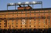 The retired number of Baltimore Orioles Hall of Fame third baseman Brooks Robinson is seen on the wall of the warehouse at Oriole Park at Camden Yards prior to a baseball game between the Orioles and the Washington Nationals, Wednesday, Sept. 27, 2023, in Baltimore. Robinson died on Tuesday at the age of 86. (AP Photo/Julio Cortez)